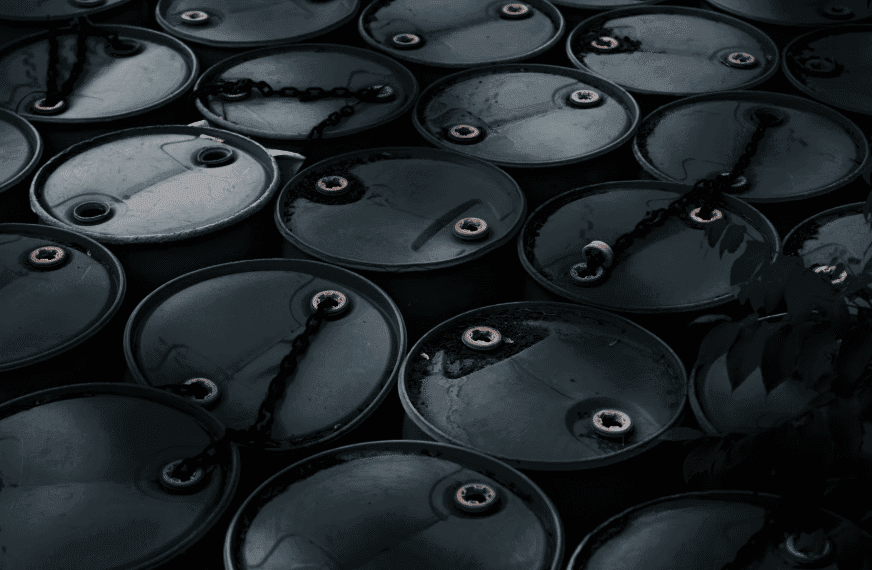 An overhead view of clean, black barrels used for storing used cooking oil, representing Renova's full-service management solutions.