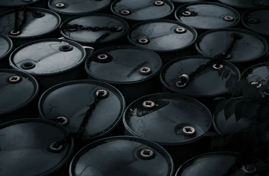 An overhead view of clean, black barrels used for storing used cooking oil, representing Renova's full-service management solutions.